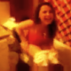 A girl films her friend peeing on the toilet.